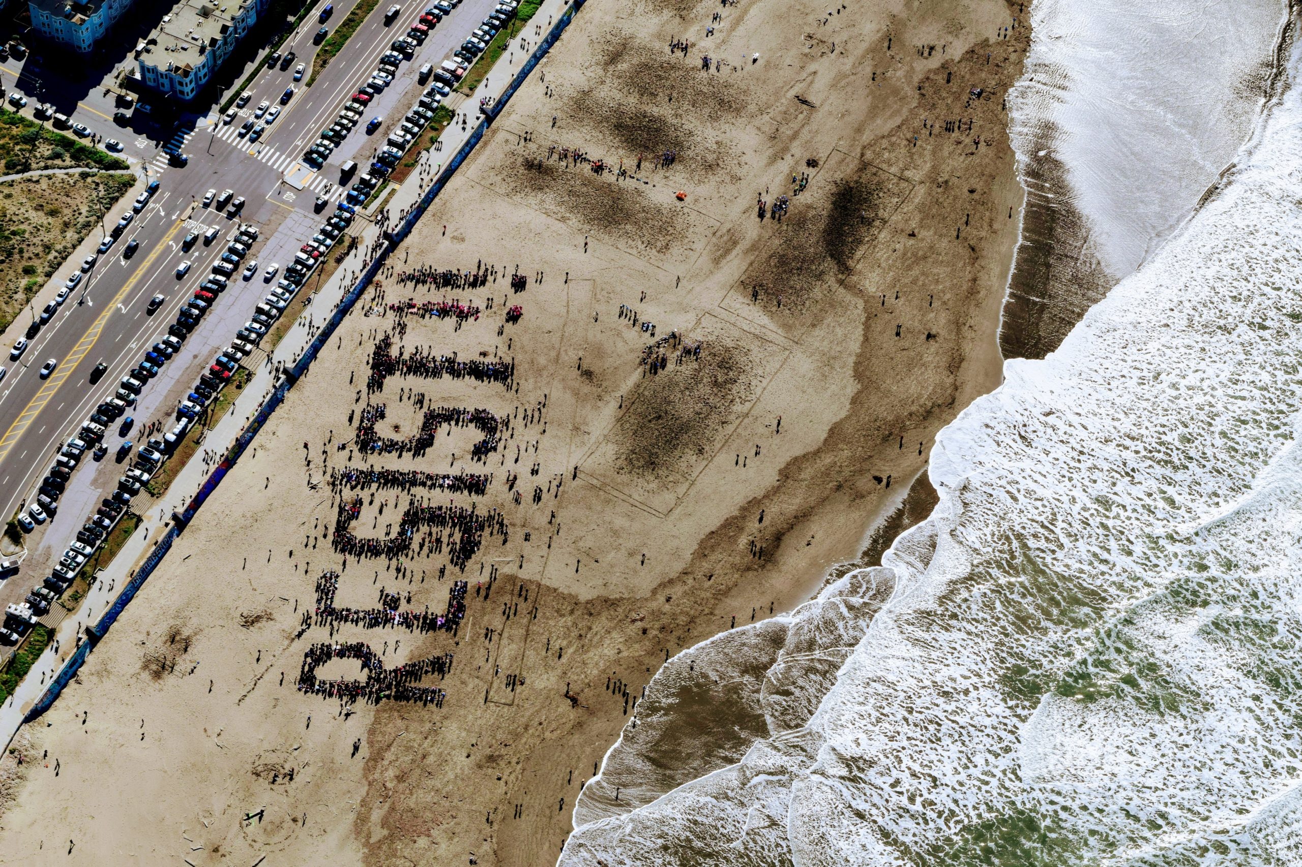 Protesters spelling out resist during ocean protest in florida